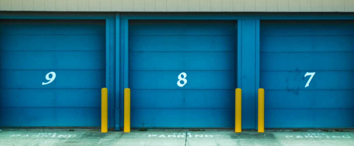 A storage facility is shown with numbered doors.