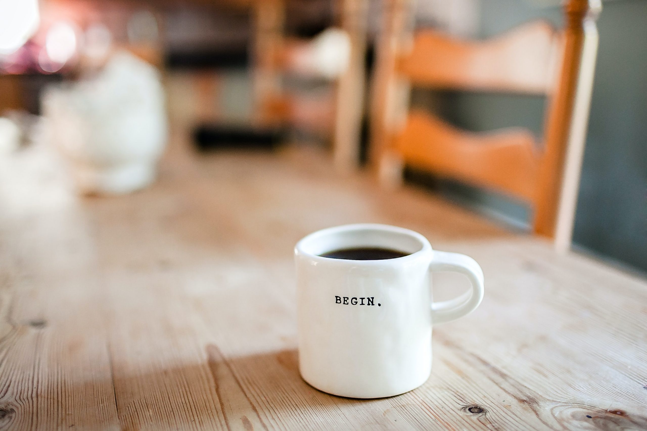 coffee cup that says "Begin."