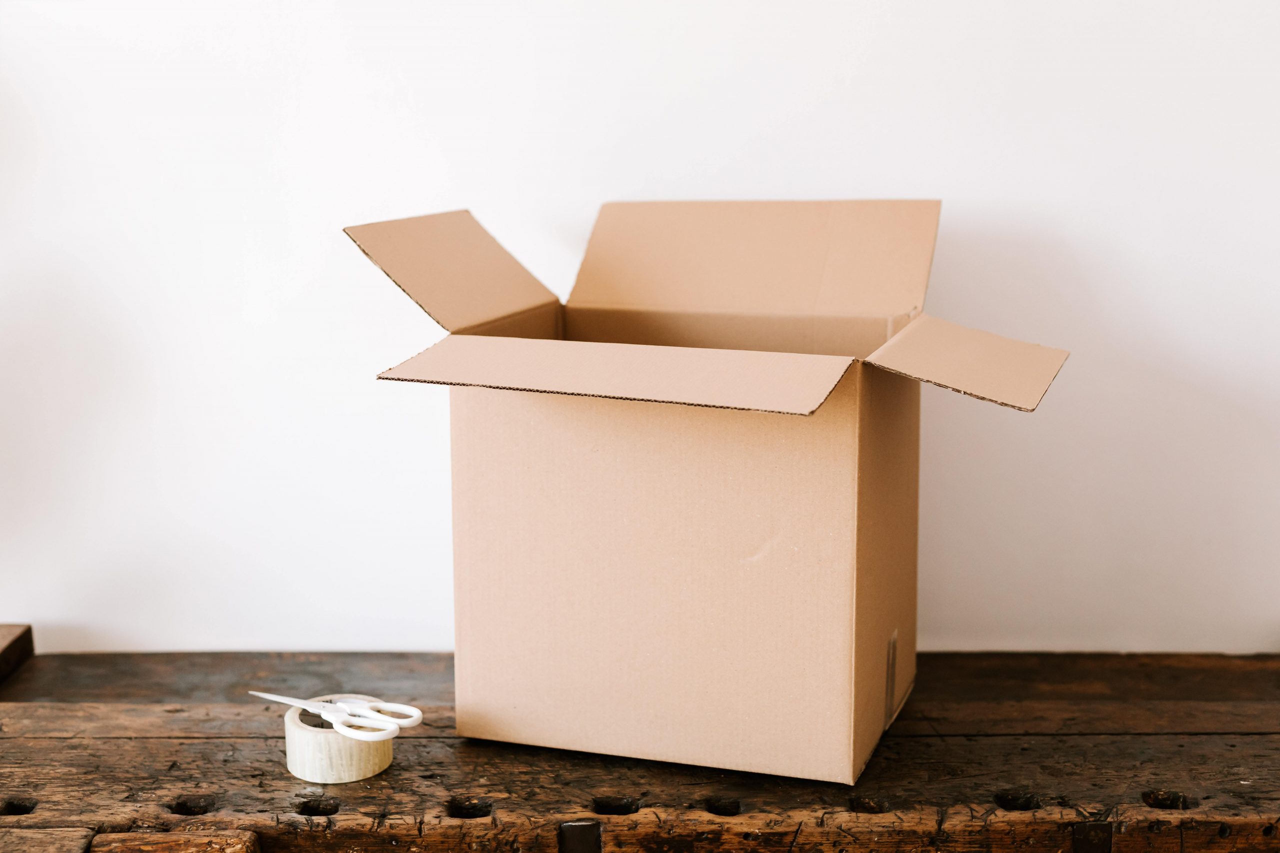 Moving Box with Tape and Scissors nearby